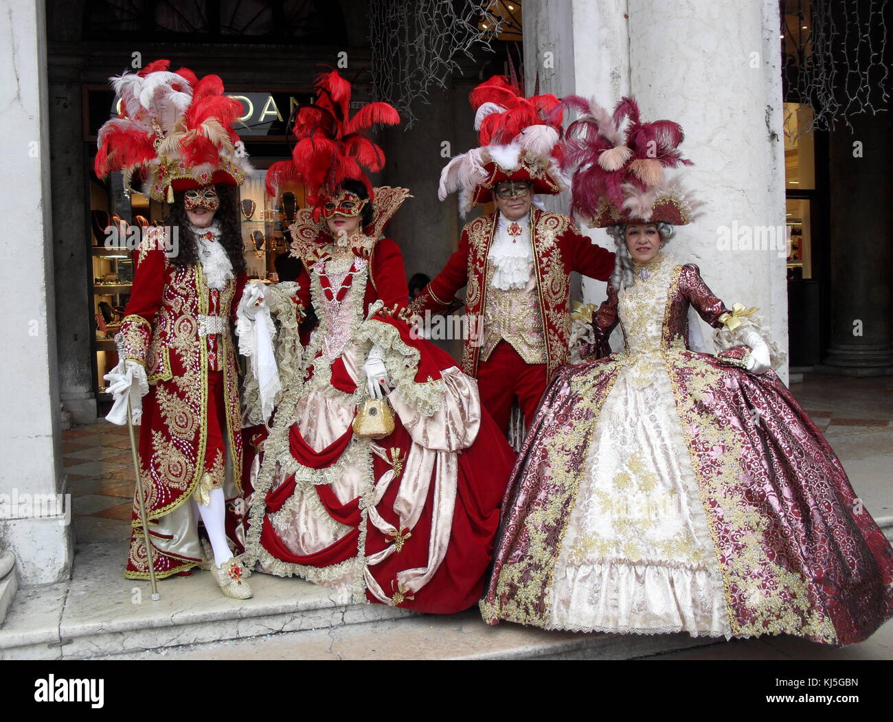 Costumed attendees at the Venice Carnival (Carnevale di Venezia), an annual festival held in Venice, Italy. Started to recall a victory of the 'Serenissima Repubblica' against the Patriarch of Aquileia, in the year 1162. In the honour of this victory, the people started to dance and gather in San Marco Square. Stock Photo