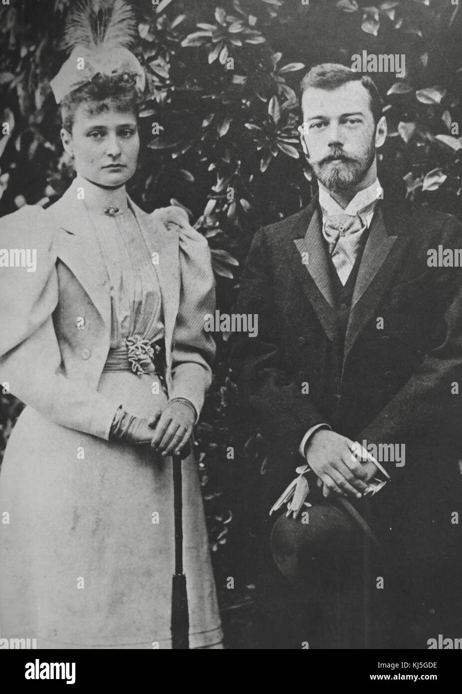 Empress Alexandra and Nicholas II of Russia. Alexandra Feodorovna (1872 – 1918), Empress of Russia as the spouse of Nicholas II, the last ruler of the Russian Empire. Originally known as Alix of Hesse and by Rhine, she was a granddaughter of Queen Victoria of the United Kingdom. Nicholas II (1868 – 1918) was the last Emperor of Russia, ruling from 1 November 1894 until his forced abdication on 15 March 1917 Stock Photo