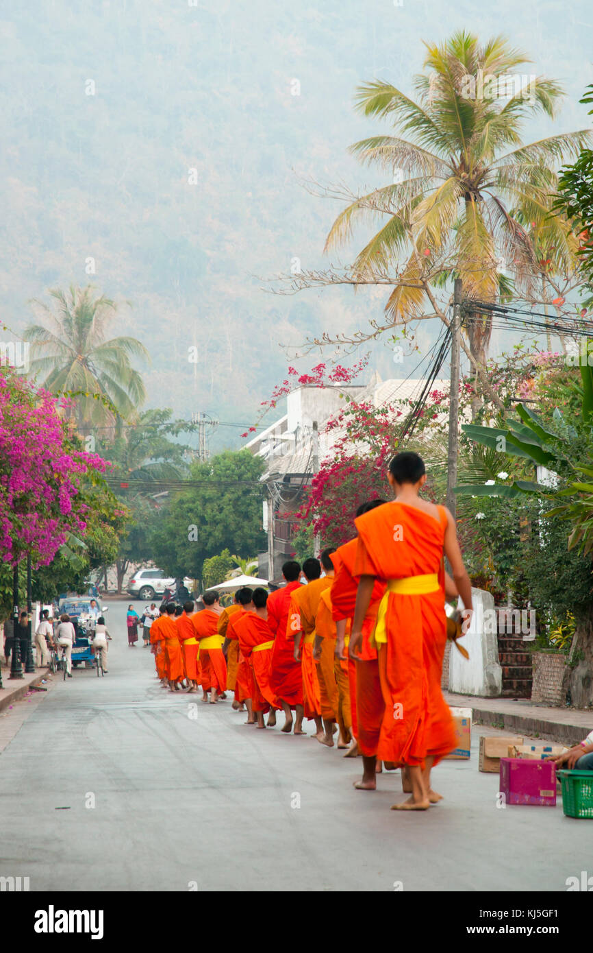 Ritual of Monks Collecting Alms - Luang Prabang - Laos Stock Photo
