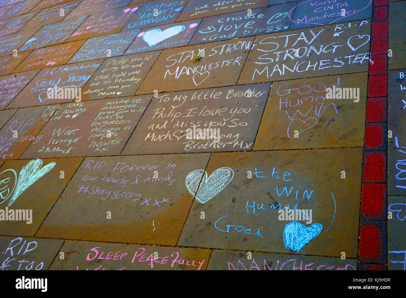 Tributes written on the ground, during the days following the 22 May 2017, suicide bombing, carried out at Manchester Arena in Manchester, England, following a concert by American singer Ariana Grande. Stock Photo