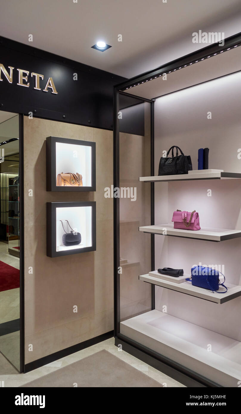 Elegant fashion store, bags and leather accessories on the shelves Stock Photo