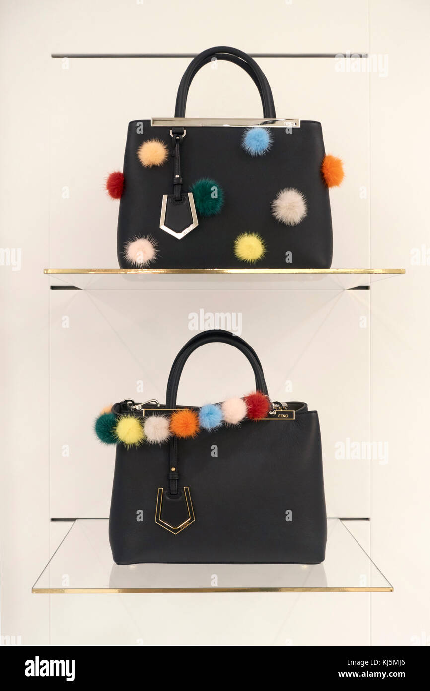 Female retail fashion store, Fendi bags with pon pon on the shelves of a store Stock Photo