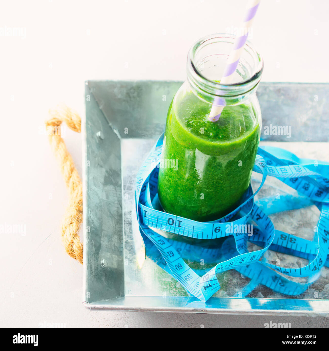 Healthy food diet lose weight concept green smoothie breakfast on gray