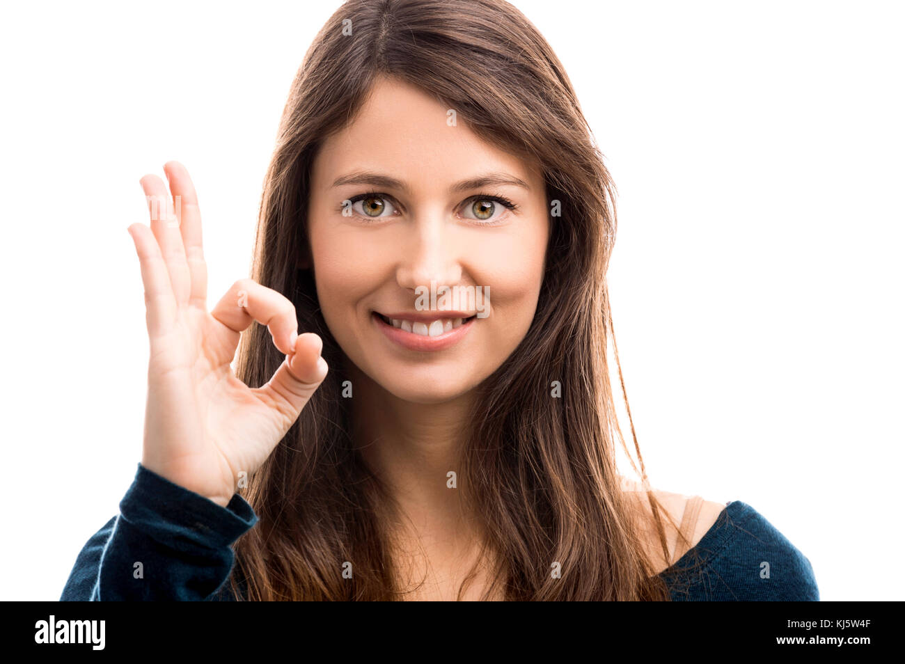 Beautiful woman doing a OK signal with her hand Stock Photo