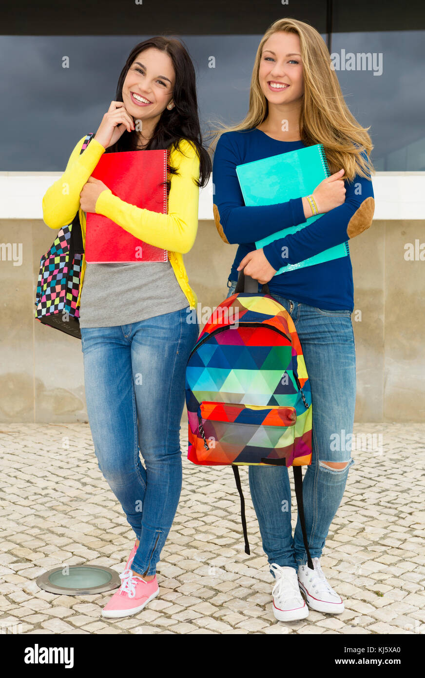 Two happy and beautiful teenage students in the school Stock Photo - Alamy