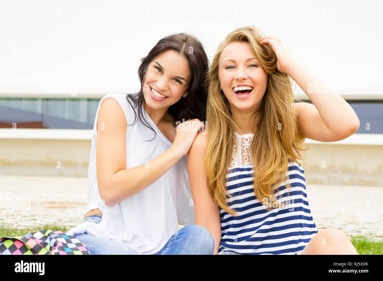 Happy teenage students in the school Stock Photo - Alamy