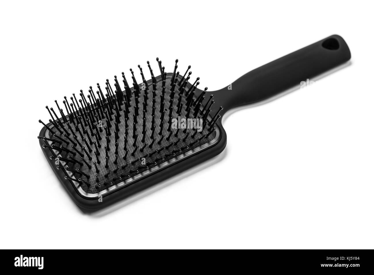 Hair brush with a black handle isolated on white Stock Photo