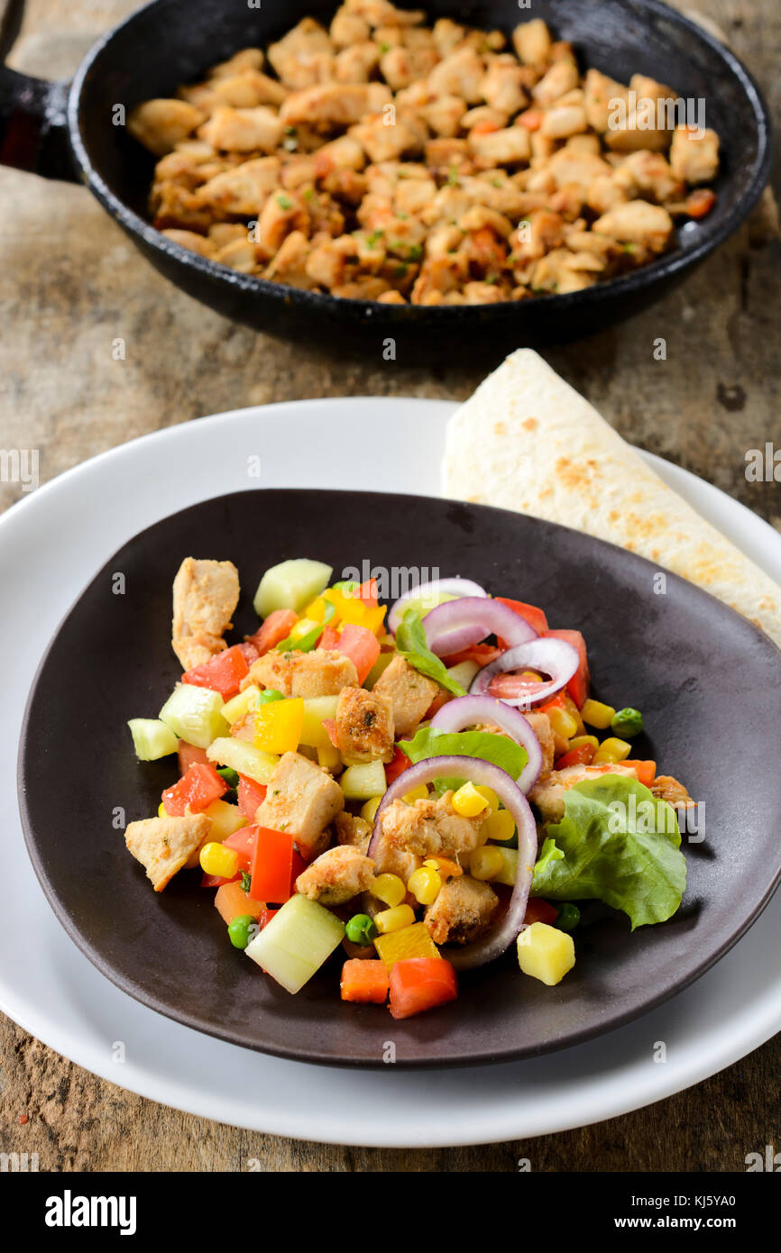 Fresh meat and vegetables salad on the plate.Selective focus on the salad Stock Photo