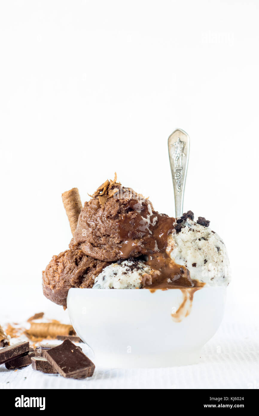 Homemade ice cream with chocolate and cookies in white bowl,selective focus and blank space Stock Photo