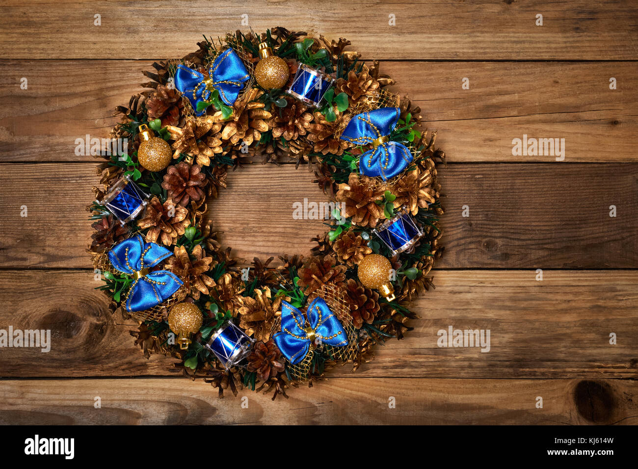 Christmas wreath on old wooden background Stock Photo