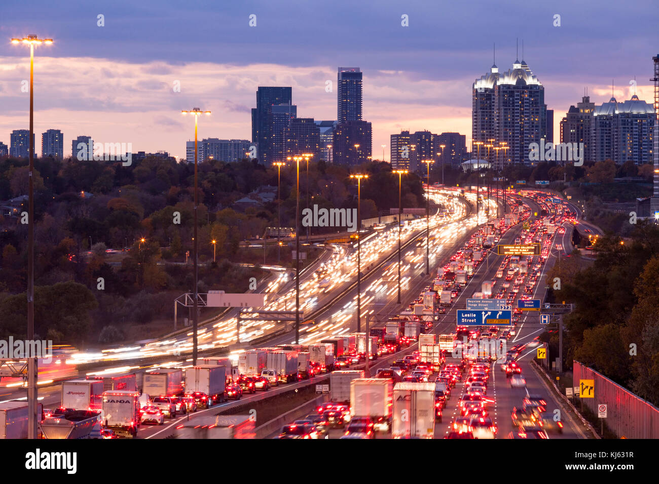 Traffic Congestion along the King's Highway 401 at dusk in Toronto, Ontario, Canada. Stock Photo