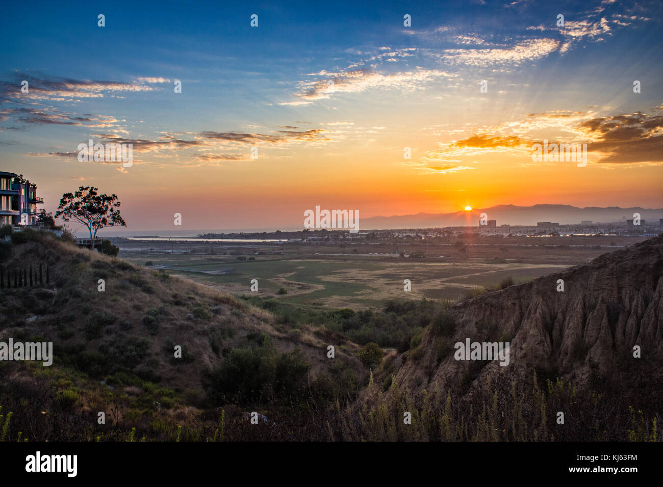 Dynamic sunset over the Ballona Wetlands from a scenic viewpoint on the Bluff Trail, Los Angeles, California Stock Photo
