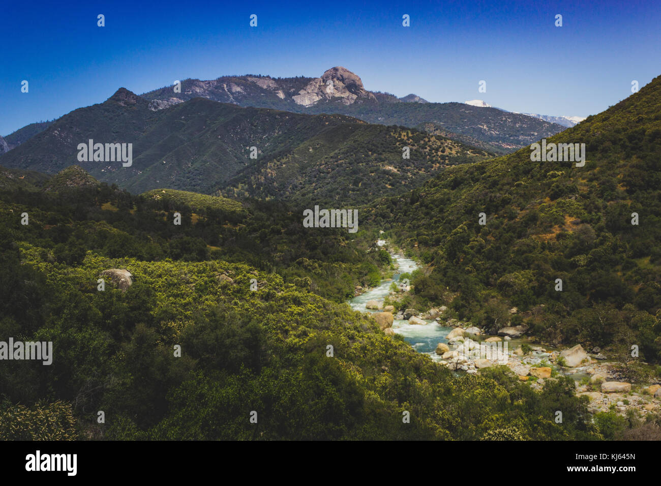 Middle Fork Kaweah River running through Sequoia National Park, California with the peak of Moro Rock in the distance. Stock Photo