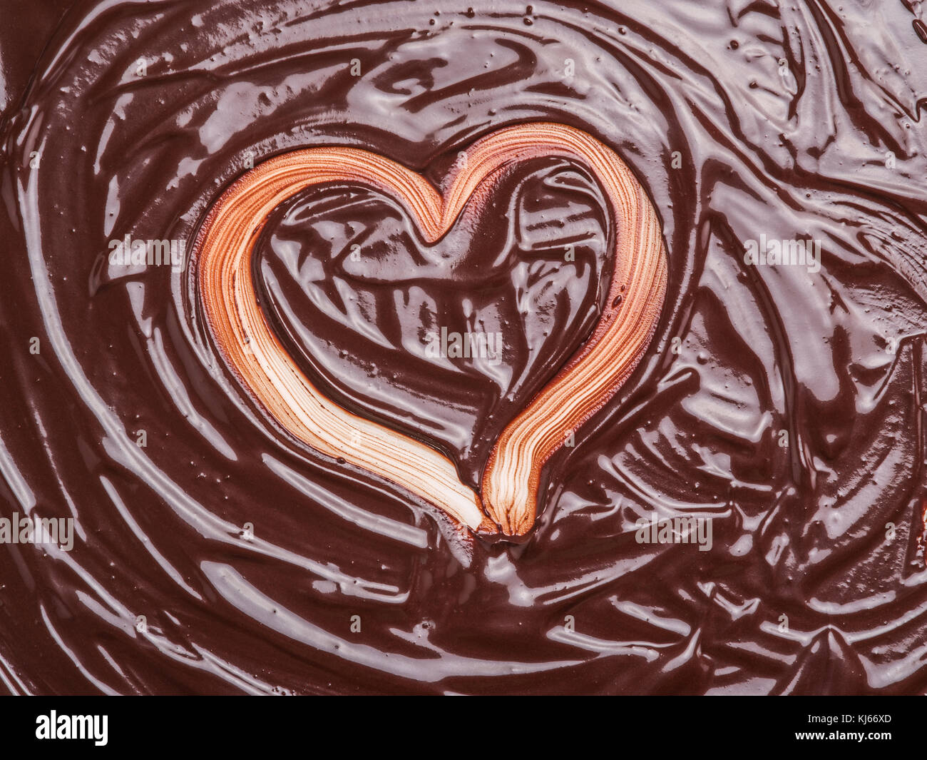 Heart shape on chocolate glaze. Stock Photo