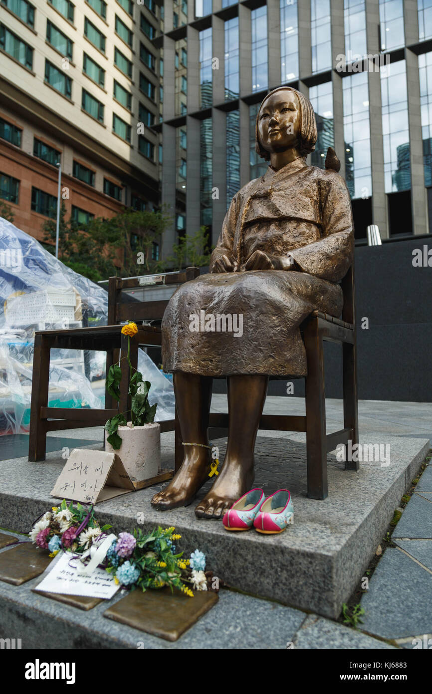 The statue of peace ( in Japan, called the comfort woman statue) facing the Japanese Embassy in Seoul, South Korea. Stock Photo