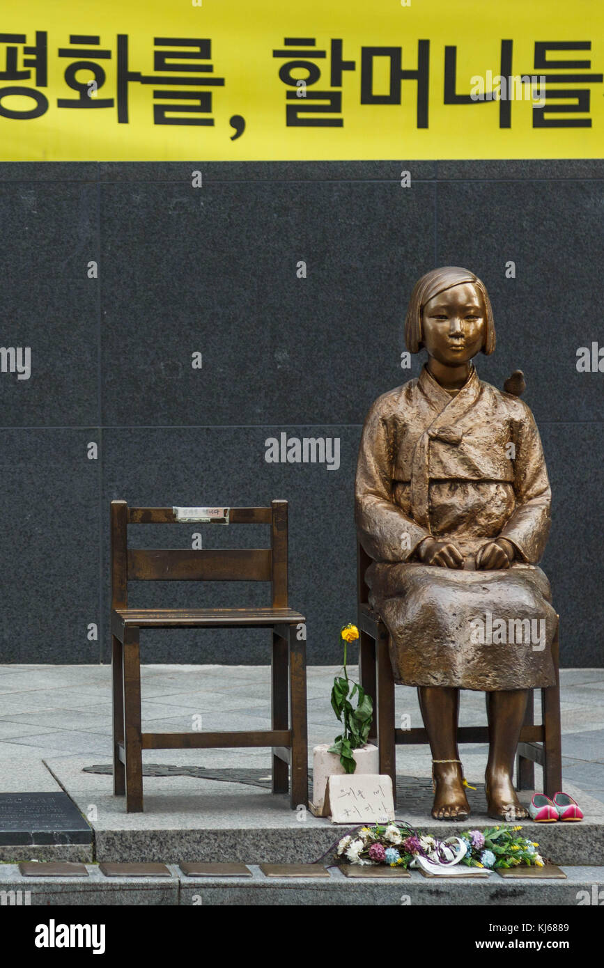 The statue of peace ( in Japan, called the comfort woman statue) facing the Japanese Embassy in Seoul, South Korea. Stock Photo