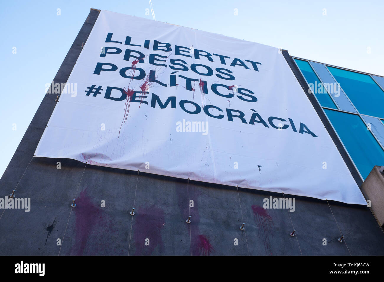 Defaced poster on town hall, or ajuntament of Sant Cugat del Valles, Barcelona. The poster replaces an earlier one torn down by far-right protestors. Stock Photo