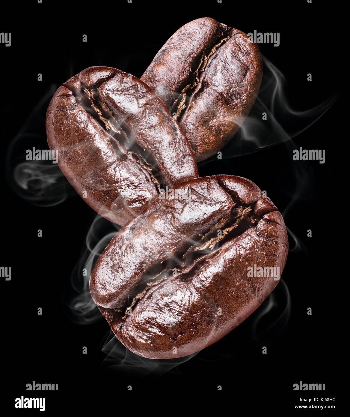 Three roasted coffee beans on the black background Stock Photo - Alamy