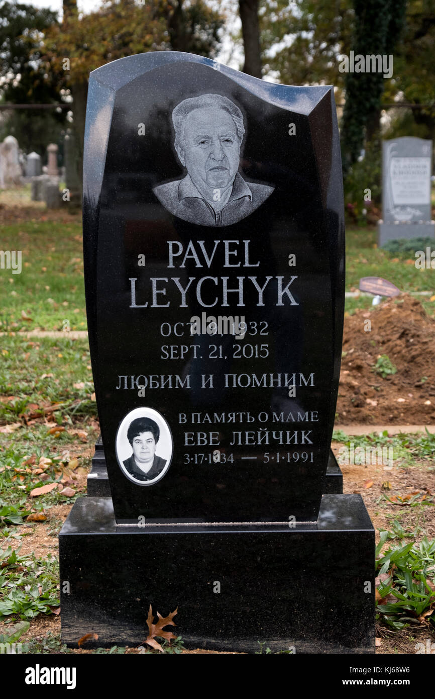 An ornate black granite tombstone with a diamond etched portrait at Montefiore Cemetery in Cambria Heights, Brooklyn, New York. Stock Photo