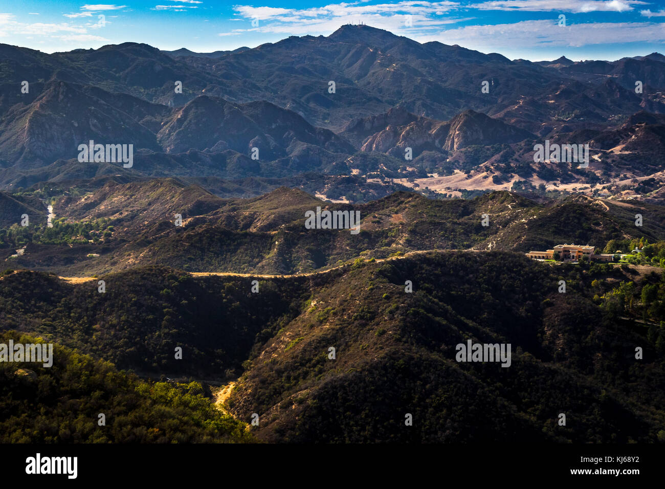 Scenic overlook of Calabasas with the Santa Monica Mountains in the background on a sunny day with blue sky and clouds, Calabasas Peak State Park, Cal Stock Photo
