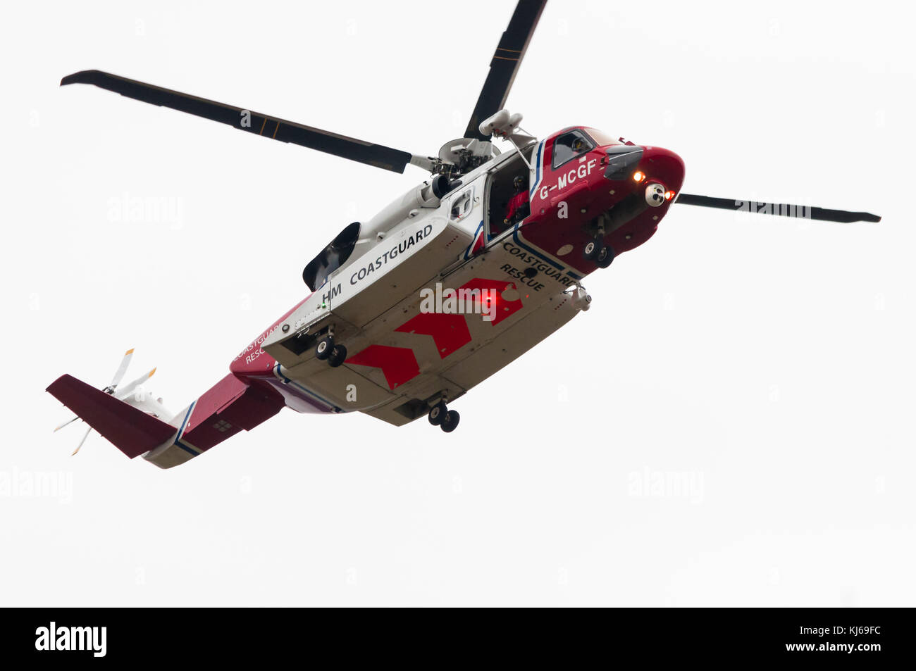 An HM coastguard Sikorsky S92 helicopter searches for a missing walker close to Inverness in the Scottish Highlands. Stock Photo