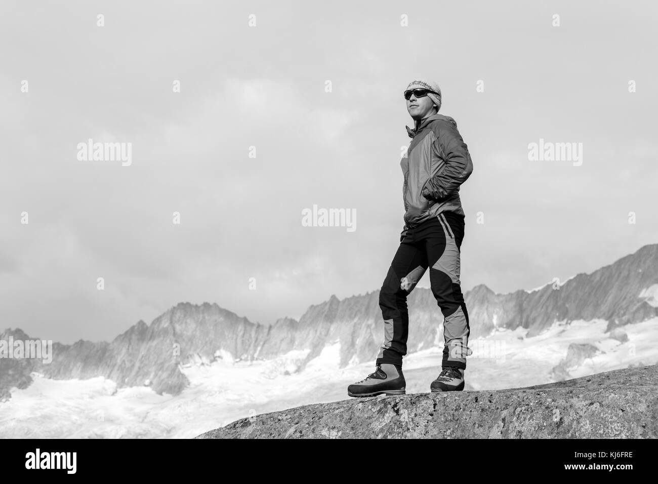 Hiker is thinking about the meaning of life in the Swiss Alps Stock ...