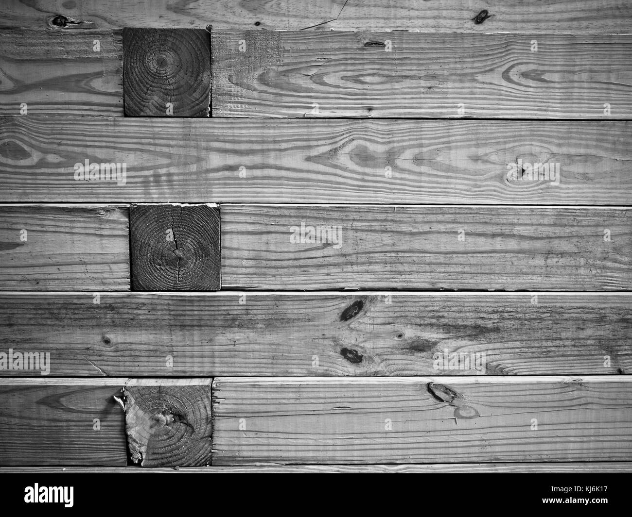 Wooden retaining wall of landscape timbers Stock Photo