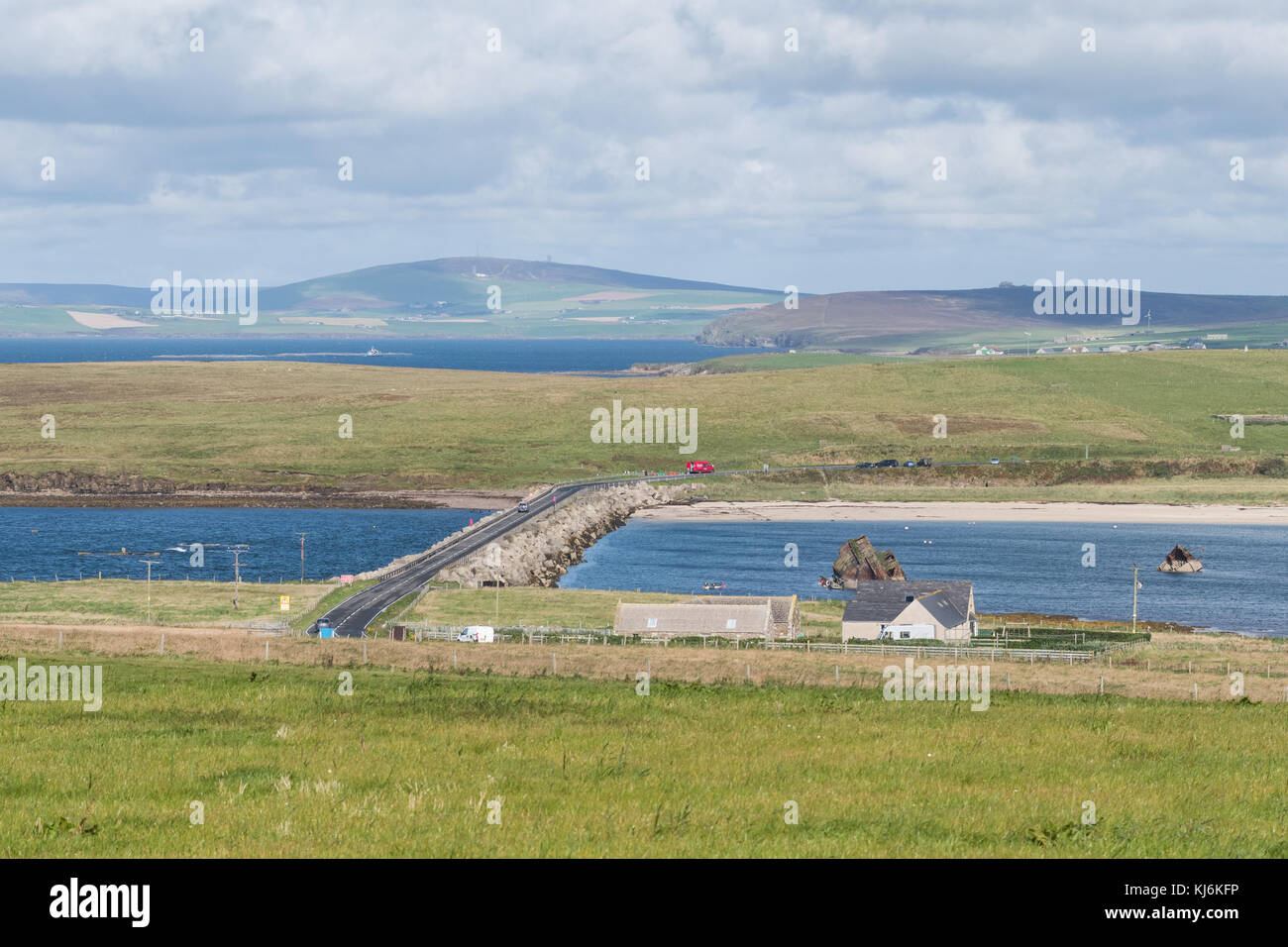 A961 on Churchill Barrier No 3 across Weddell Sound looking from Burray towards Glims (Glimps) Holm, with block ships visible on the right, Orkney Stock Photo