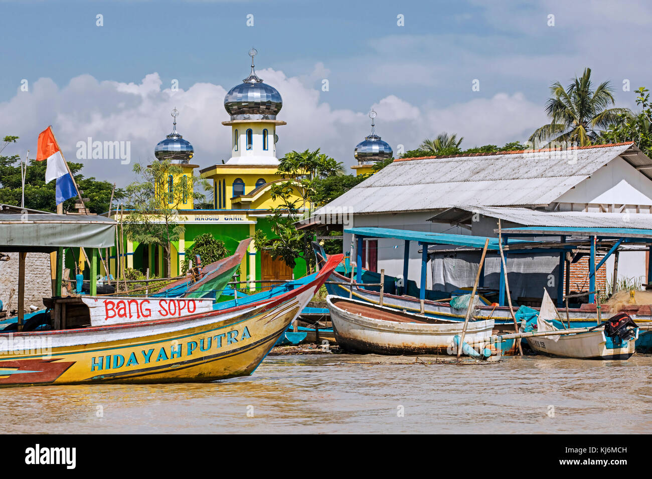 Boats and mosque in little Indonesian village between Pangandaran and Cilacap, West Java, Indonesia Stock Photo