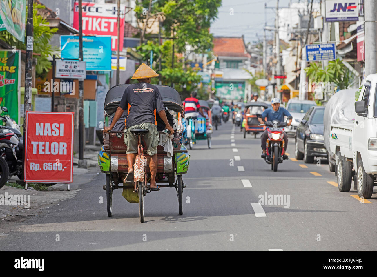 Cycle rickshaws / becak for public transport in the city Yogyakarta, Java, Indonesia Stock Photo