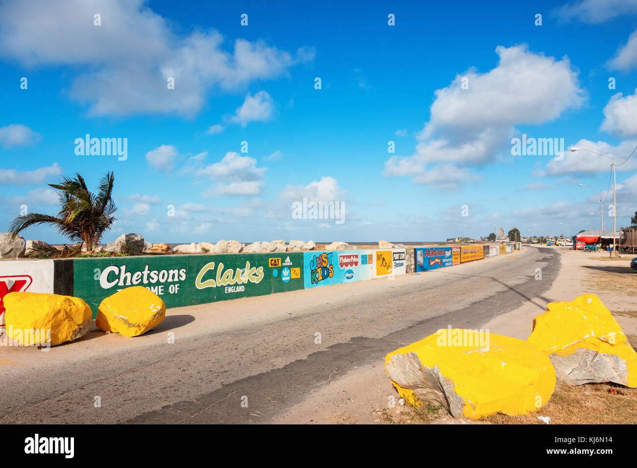 Seawall Covered With Ads And A Coastal Road In Georgetown Guyana Stock Photo Alamy