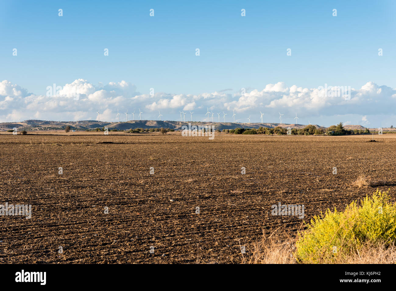 Agricultural land and wind turbines on a hill - cloudy day Stock Photo ...