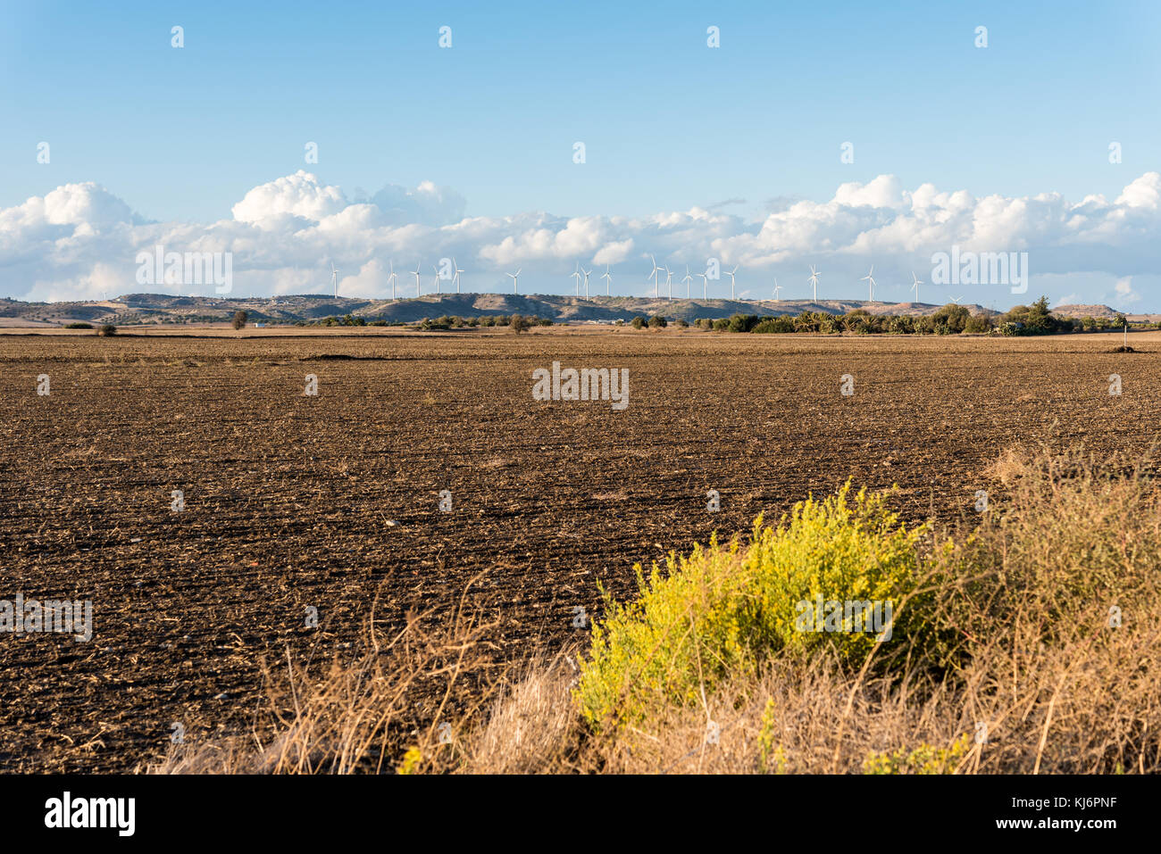 Agricultural land and wind turbines on a hill - cloudy day Stock Photo ...