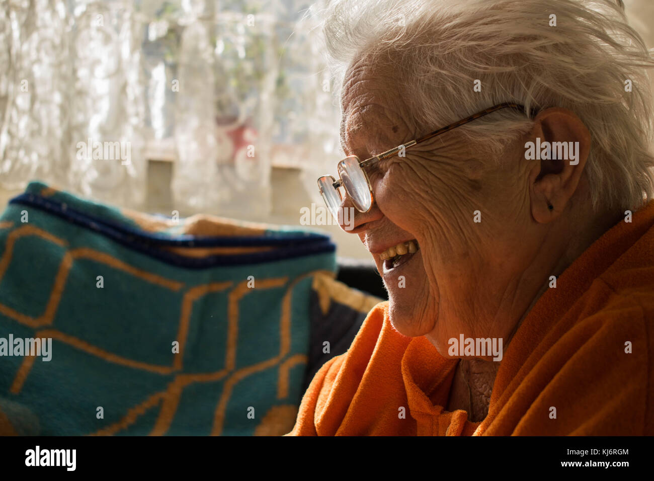 Women who survived so much in her life and still smilling and looking forward to life. Storyteller. Stock Photo