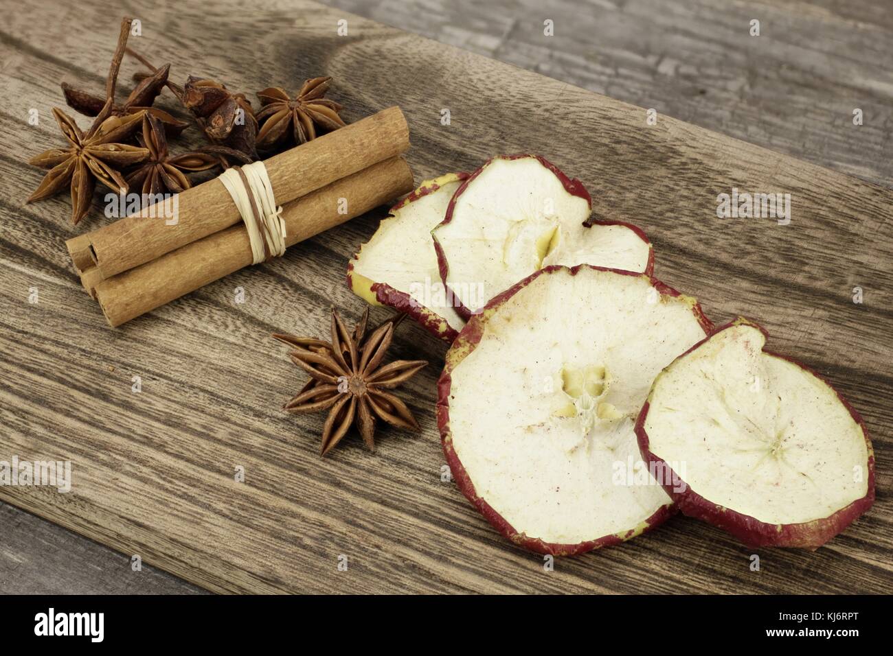Christmas decoration with star anise, cinnamon sticks and dried apple slices Stock Photo