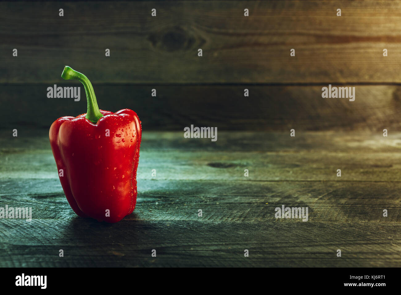 Fresh ripe bell pepper on a wooden table Stock Photo - Alamy