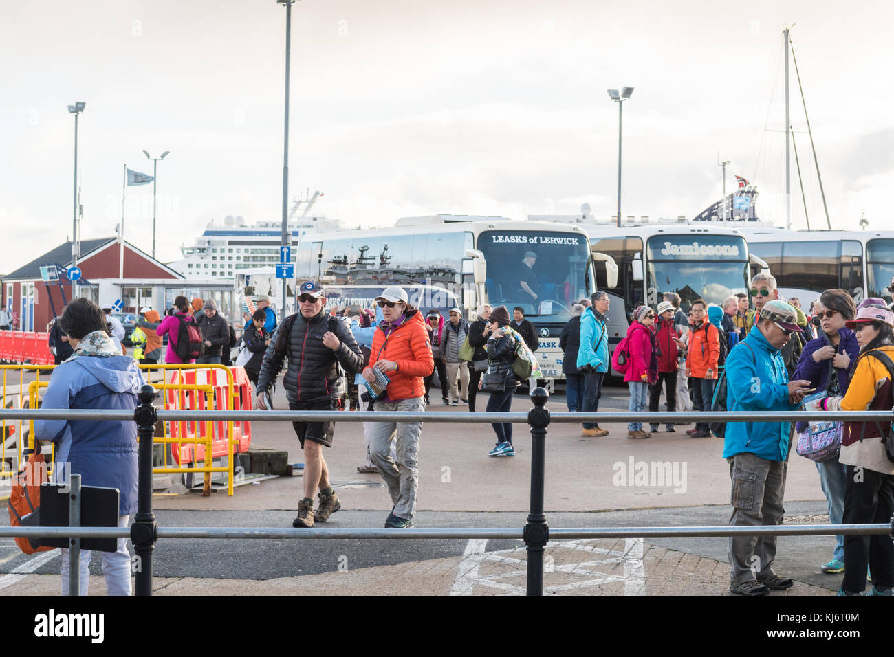 Lerwick harbour crowded with tourists and coaches as people disembark from a cruise ship, Lerwick, Shetland Islands, Scotland, UK Stock Photo