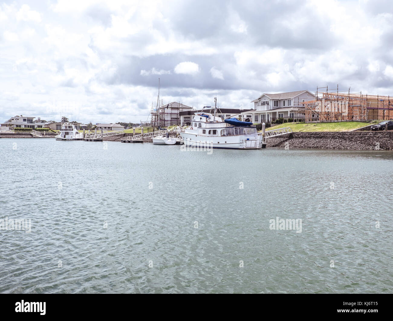 Waterfront houses with private boat jetties under construction at