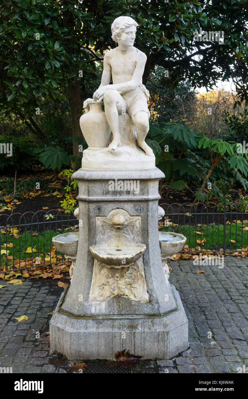 A Victorian drinking fountain in St James' Park in London features a statue of a water carrier by C H Mabey Stock Photo