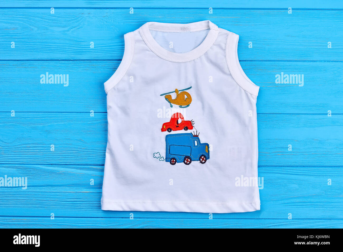 Baby boy white t-shirt print design. Toddler boy cotton t-shirt with  transport illustration, blue wooden background Stock Photo - Alamy