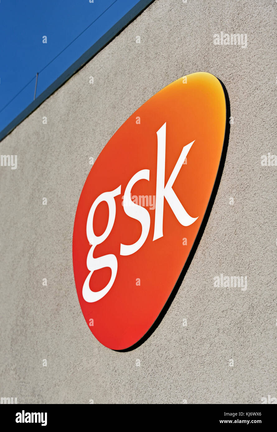 GSK company logo. GlaxoSmith Kline Pharmaceutical Factory. Ulverston, Cumbria, England, United Kingdom, Europe. Stock Photo