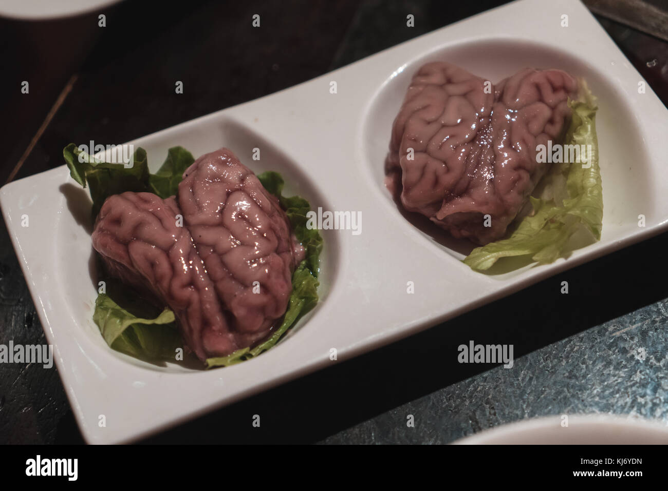 Exotic chinese food like pig brains to be eaten within popular chinese soup Hot Pot in Chengdu, Sichuan Province, China Stock Photo
