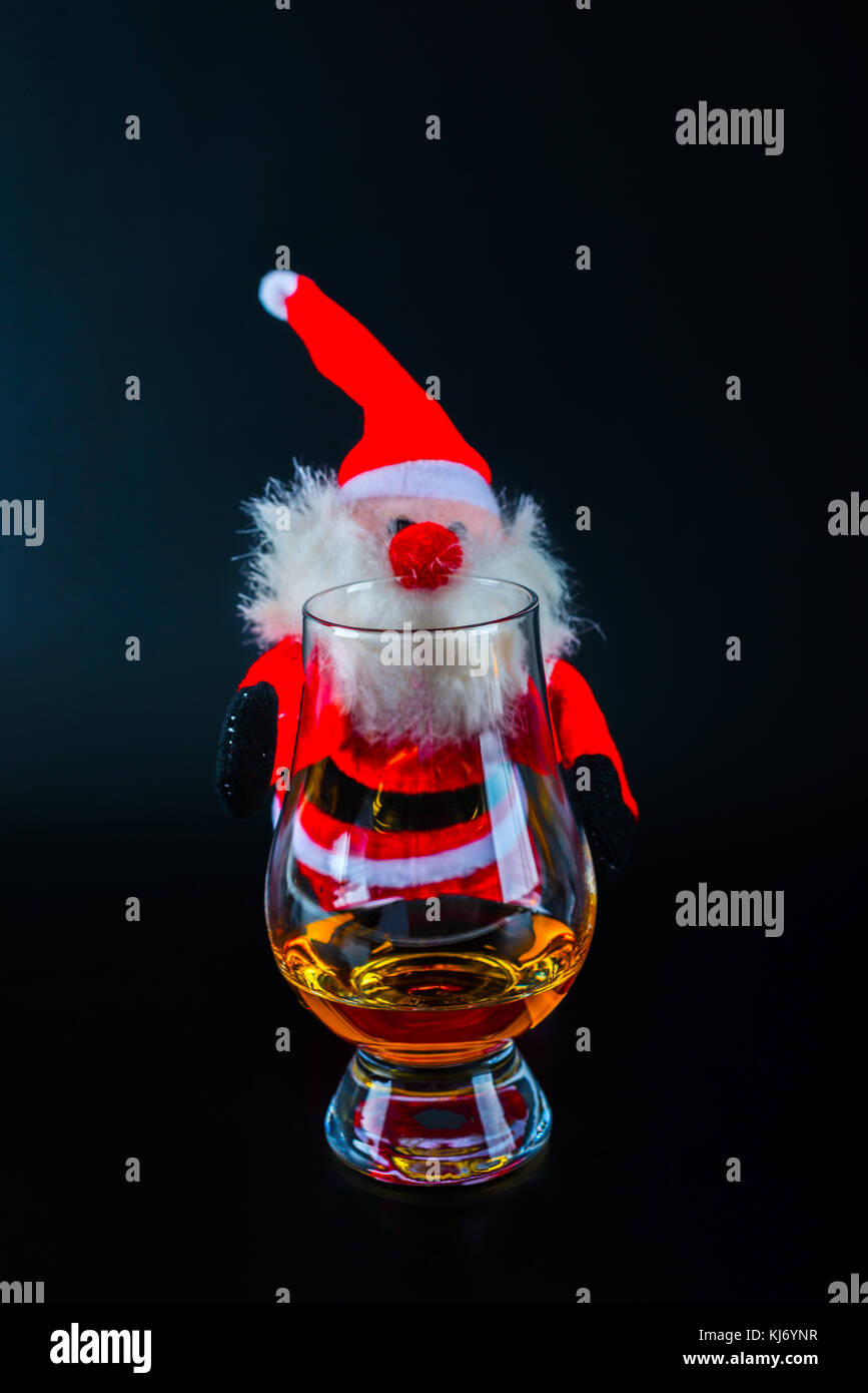 Santa Claus with single malt whiskey glass, Symbol of Christmas holiday