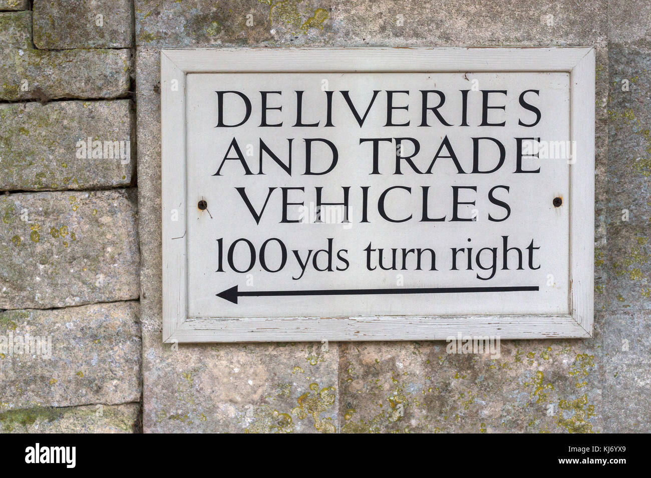 Deliveries and Trade Entrance Sign, UK Stock Photo