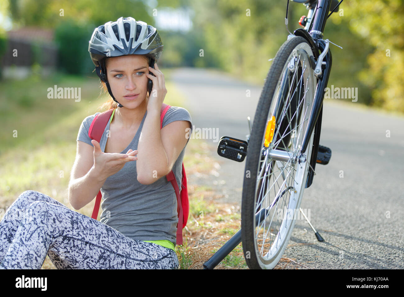 biker resting to make a call Stock Photo