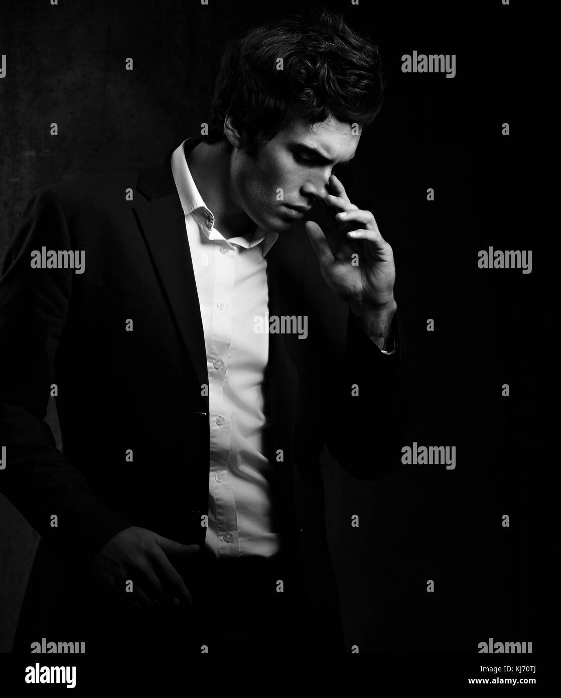 images Dramatic Portrait Poses https www alamy com stock image thinking charismatic man posing and looking down on dark shadow dramatic 166111474 html