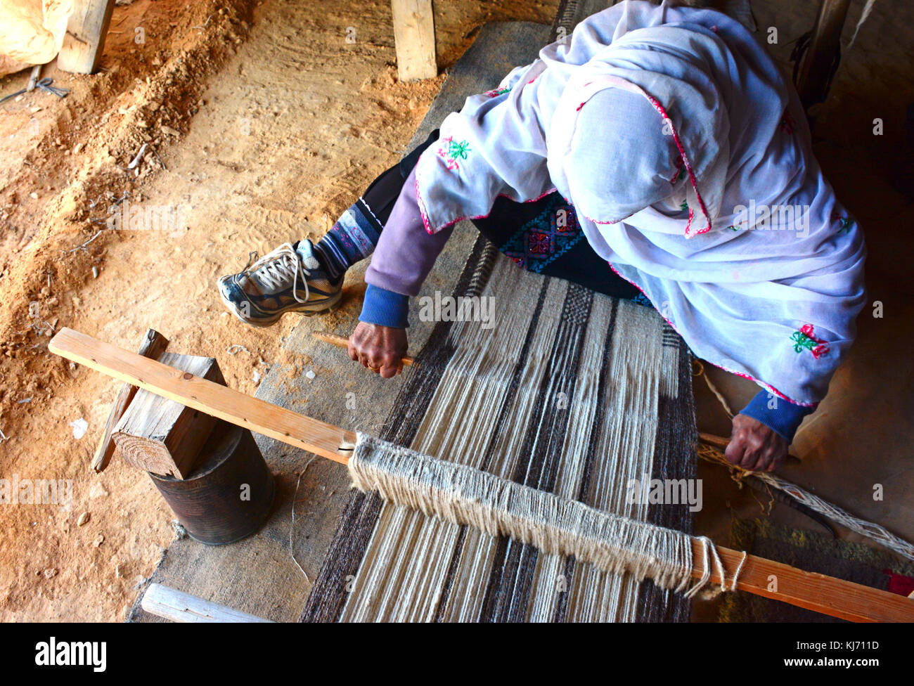 Bedouin Art,Woman making a carpet Stock Photo