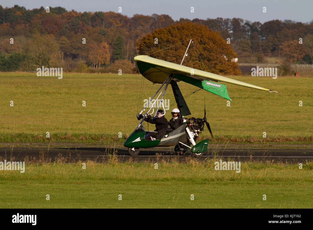 micrlight on runway with pilot and passenger Wolverhampton  Halfpenny Green Airport. Staffordshire. England. UK Stock Photo