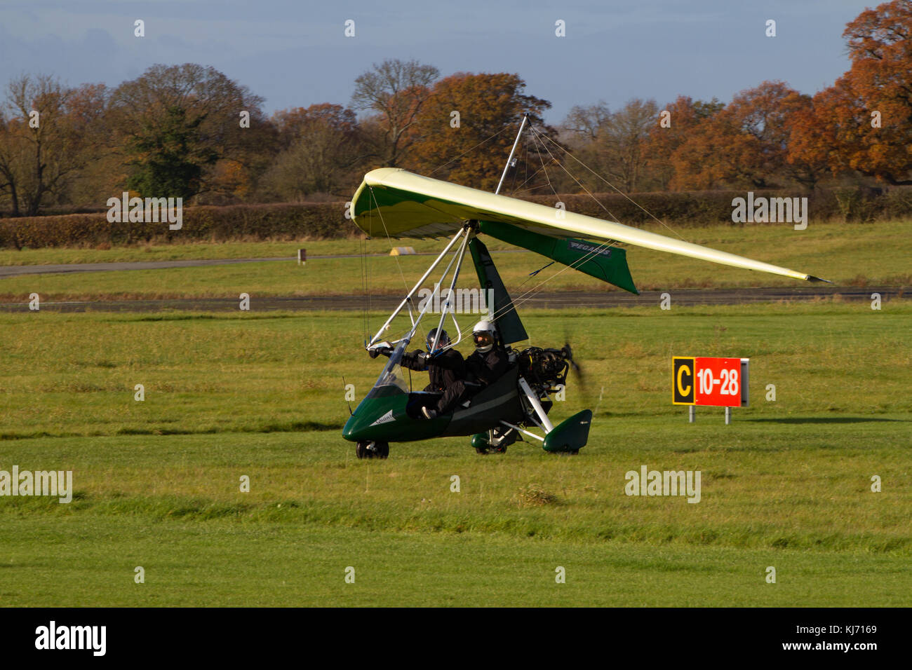 micrlight on runway with pilot and passenger Wolverhampton  Halfpenny Green Airport. Staffordshire. England. UK Stock Photo