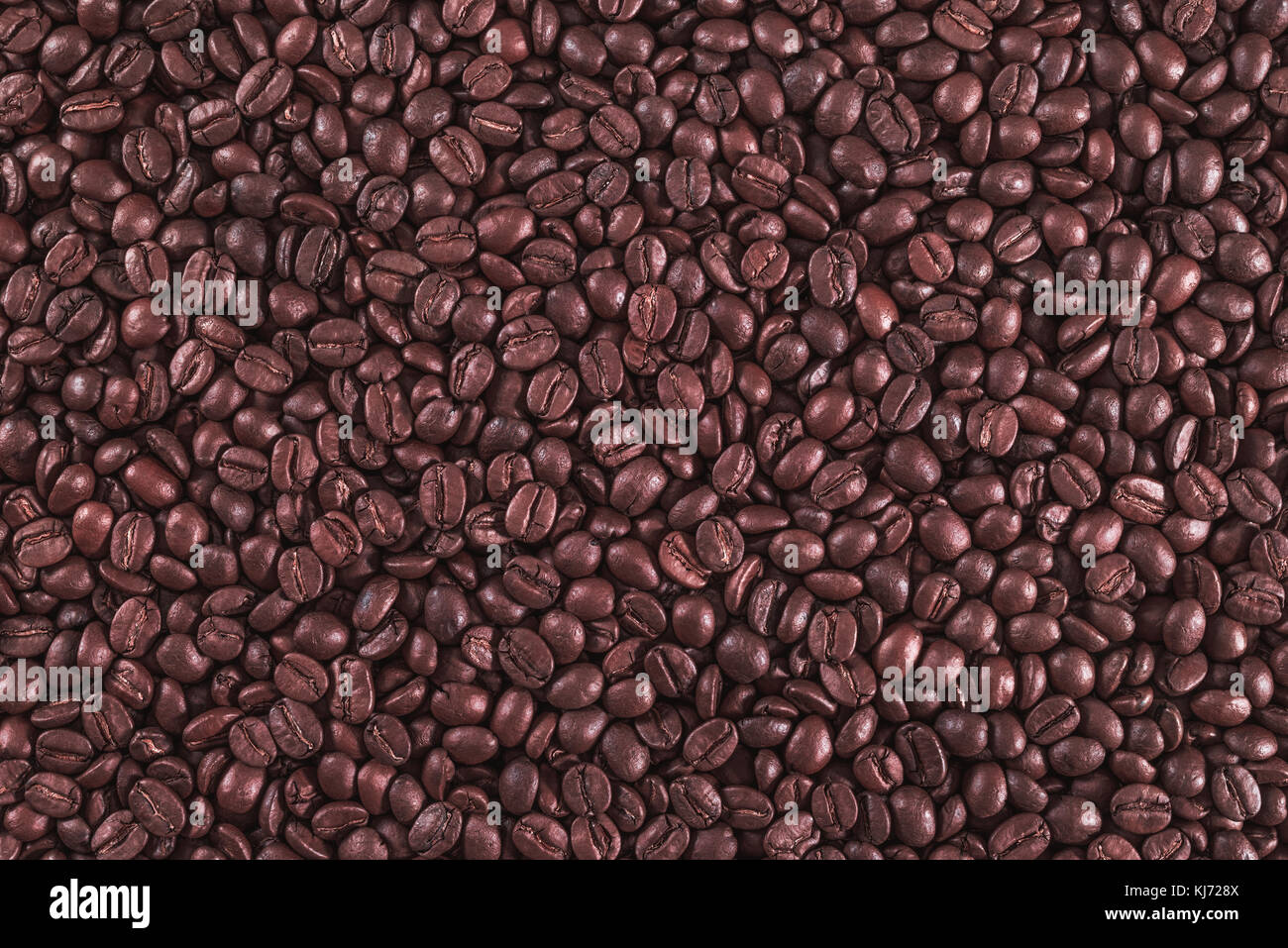 Roasted coffee beans on a flat background Stock Photo - Alamy